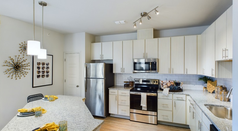 Large kitchen with island and white cabinets