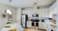 Large kitchen with island and white cabinets