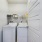 Laundry room with washer and dryer and shelves