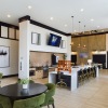 Clubhouse with seating, bar, and shuffleboard table