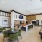 Clubhouse with seating, bar, and shuffleboard table