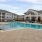 lounge chairs next to outdoor swimming pool