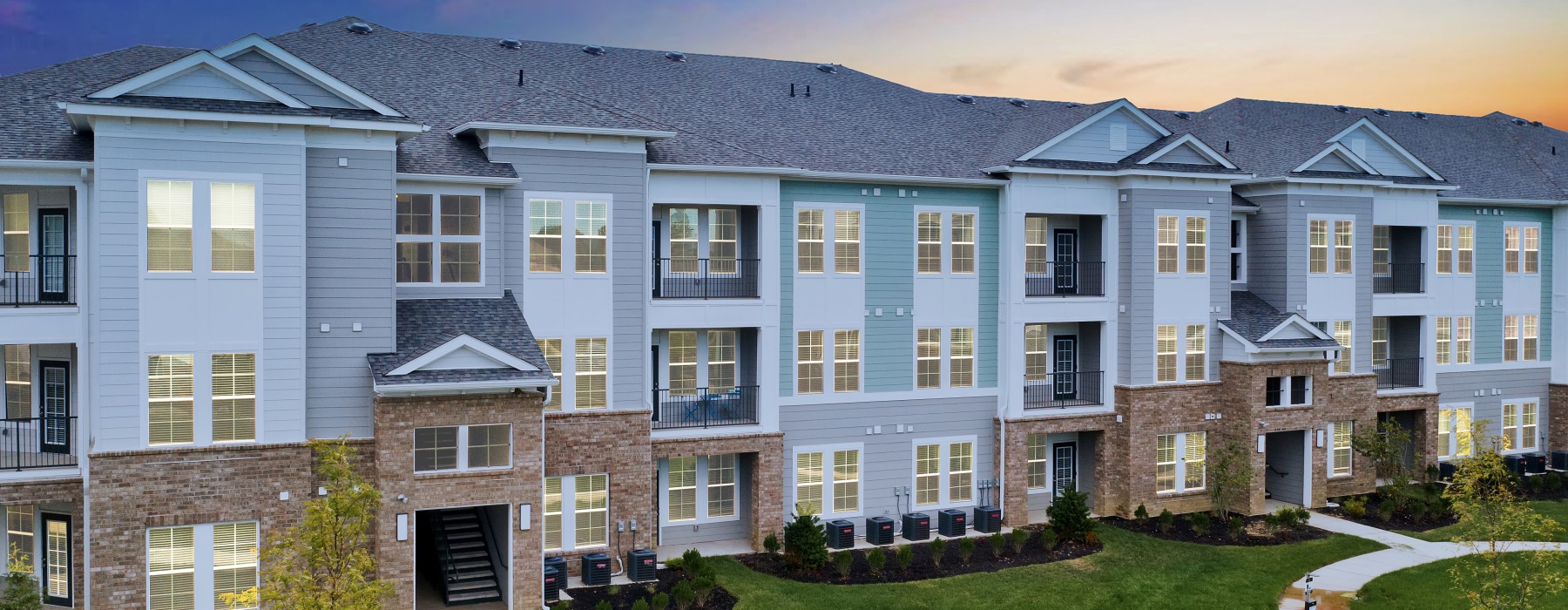 Apartment building exterior at dusk