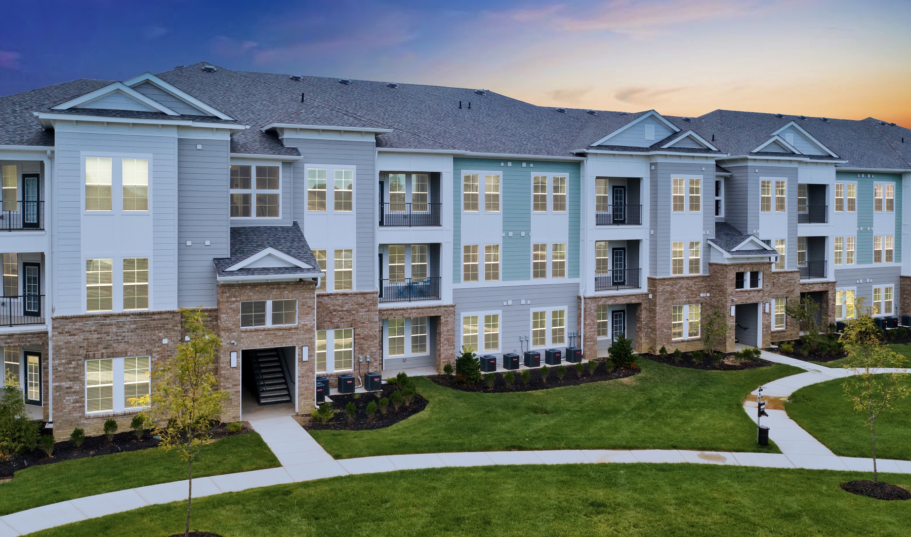 Apartment building exterior at dusk